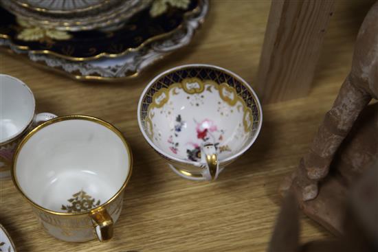 A collection of 19th century floral painted teaware and a French gilt decorated two handled vase